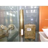 An artillery shell, together with a brass clad box