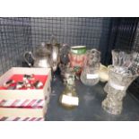 A cage containing: napkin rings, sivler plated three piece tea service, a character jug, plus