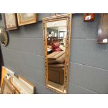 5132 A narrow rectangular mirror in floral frame