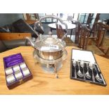 2 boxes containing silver plated napkin rings and teaspoons plus a spirit kettle
