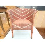 Pink painted Lloyd Loom style armchair