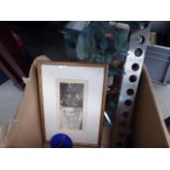 Box containing a surreal engraving, wine rack and household goods