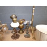 A brass tripod oil lamp stand, plus four other lamps