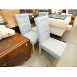 Three grey fabric button back dining chairs