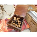 Oak box containing chess pieces and a qty of dolls clothing