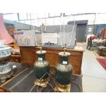 Pair of brass and green pottery table lamps