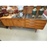 1970's teak inverted bow fronted sideboard with drawers to the side