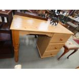 Pine finished desk with three drawers to the side