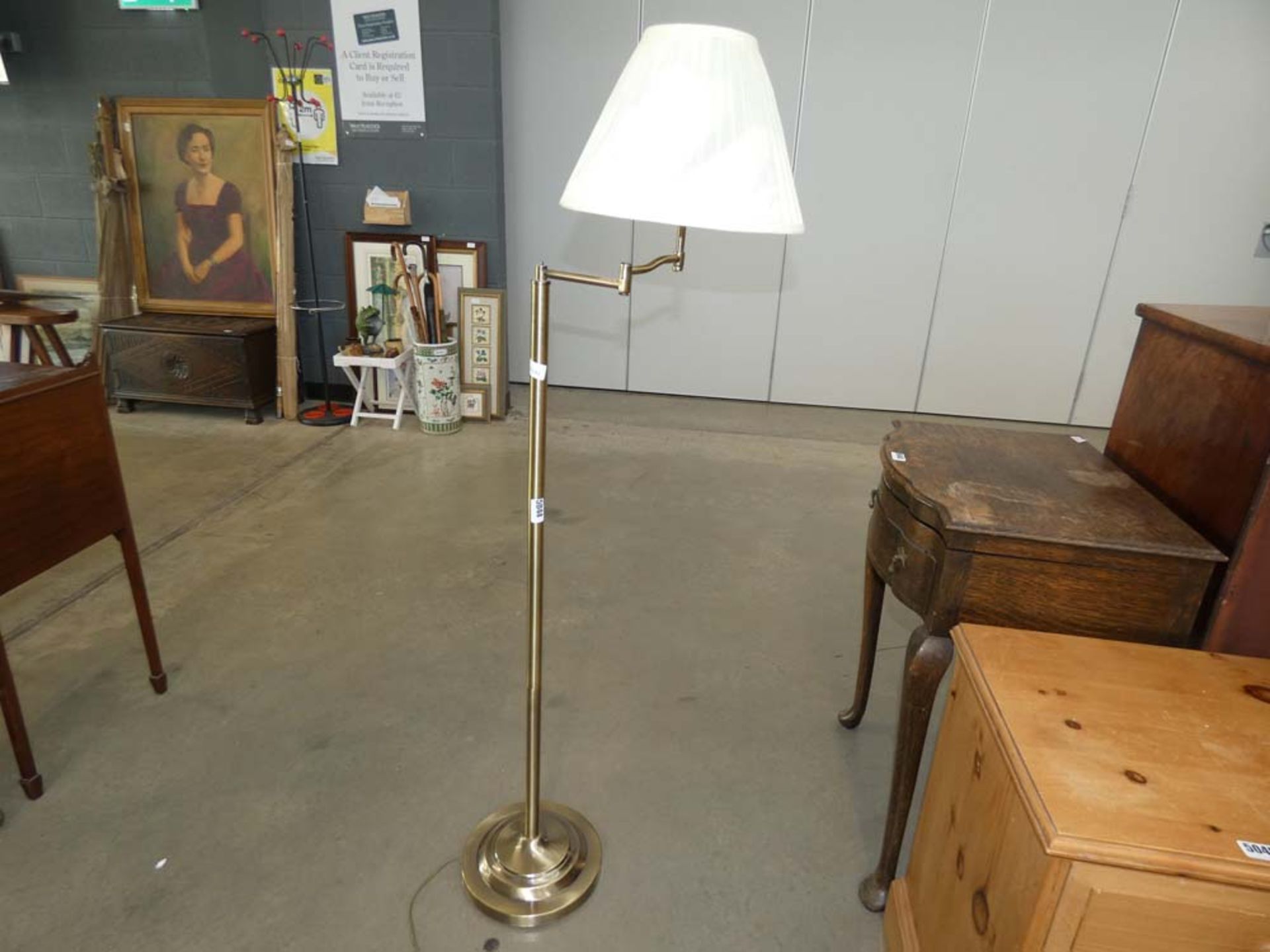 Brass finished adjustable floor lamp