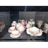 A cage containing: ginger jars, teapots, jugs and dishes