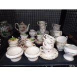 A cage containing a quantity of Staffordshire tea service, together with other cups & saucers