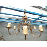 A brass six branch ceiling light