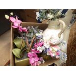 A box containing a large quantity of artificial flowers