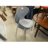 4 grey moulded plastic chairs