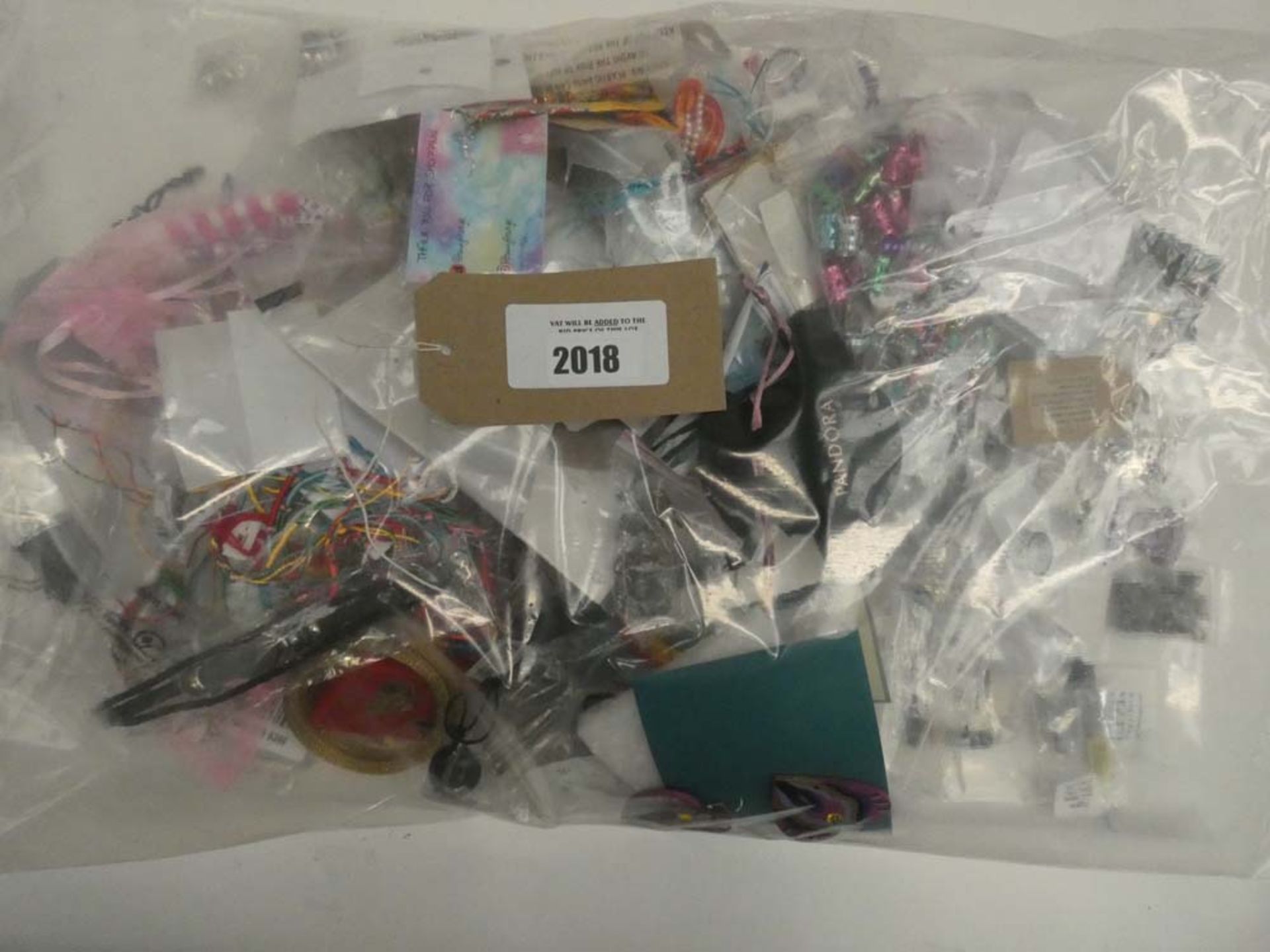 Bag containing quantity of loose costume and dress jewellery