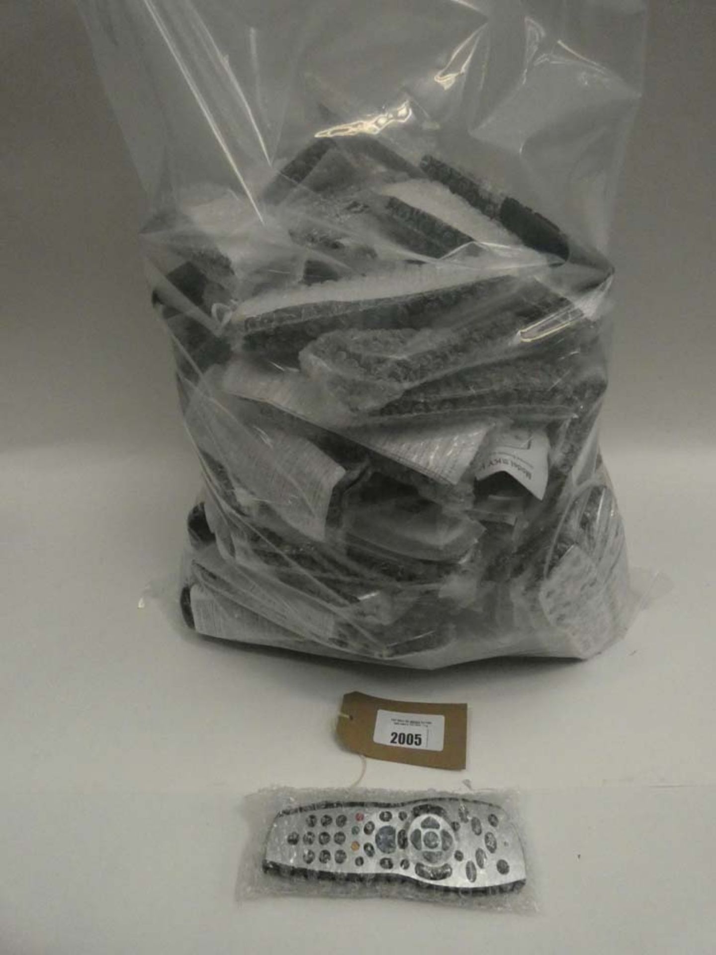 Bag containing large quantity of various Sky replacement remotes