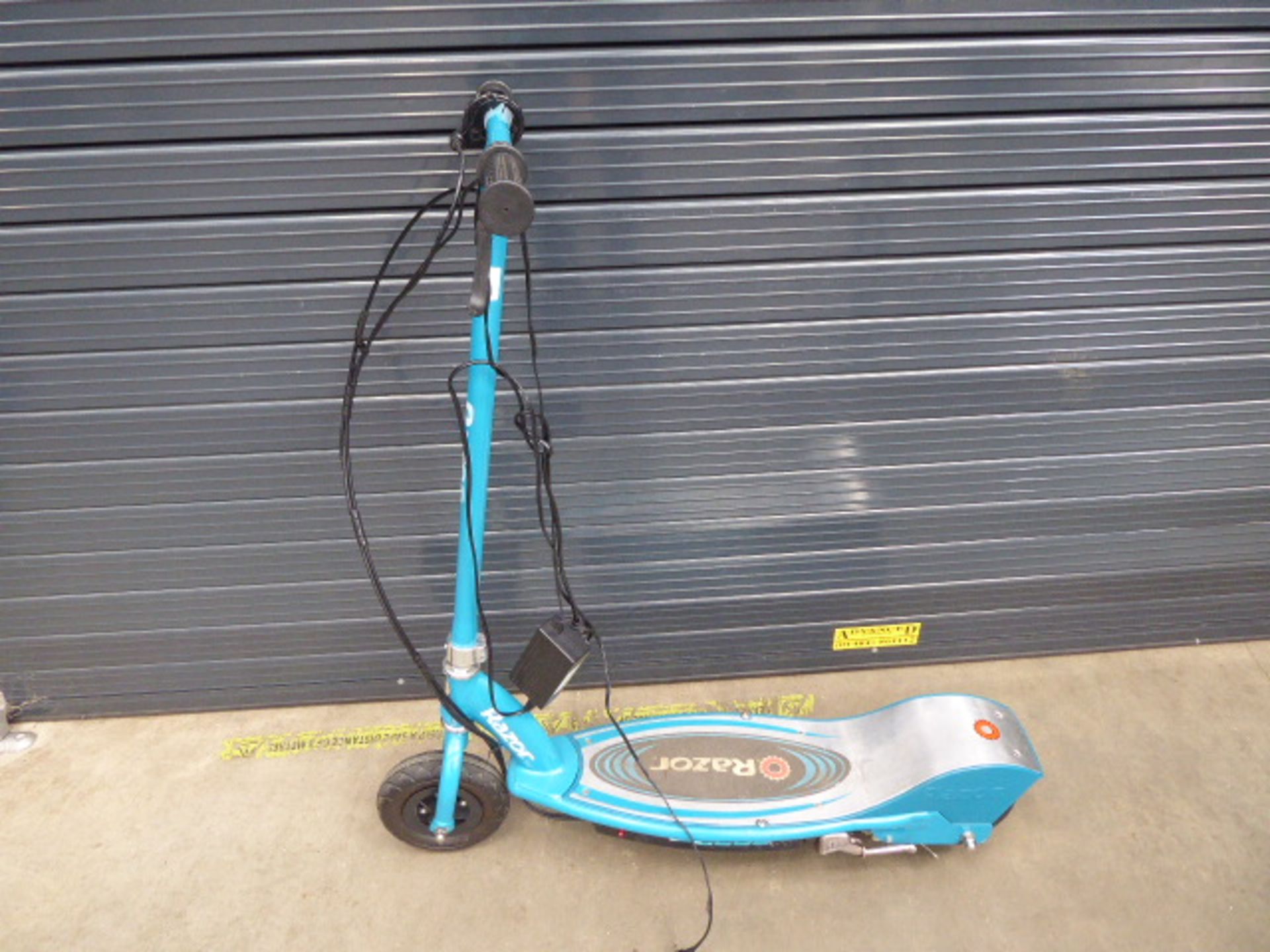 Green Razor electric scooter with charger