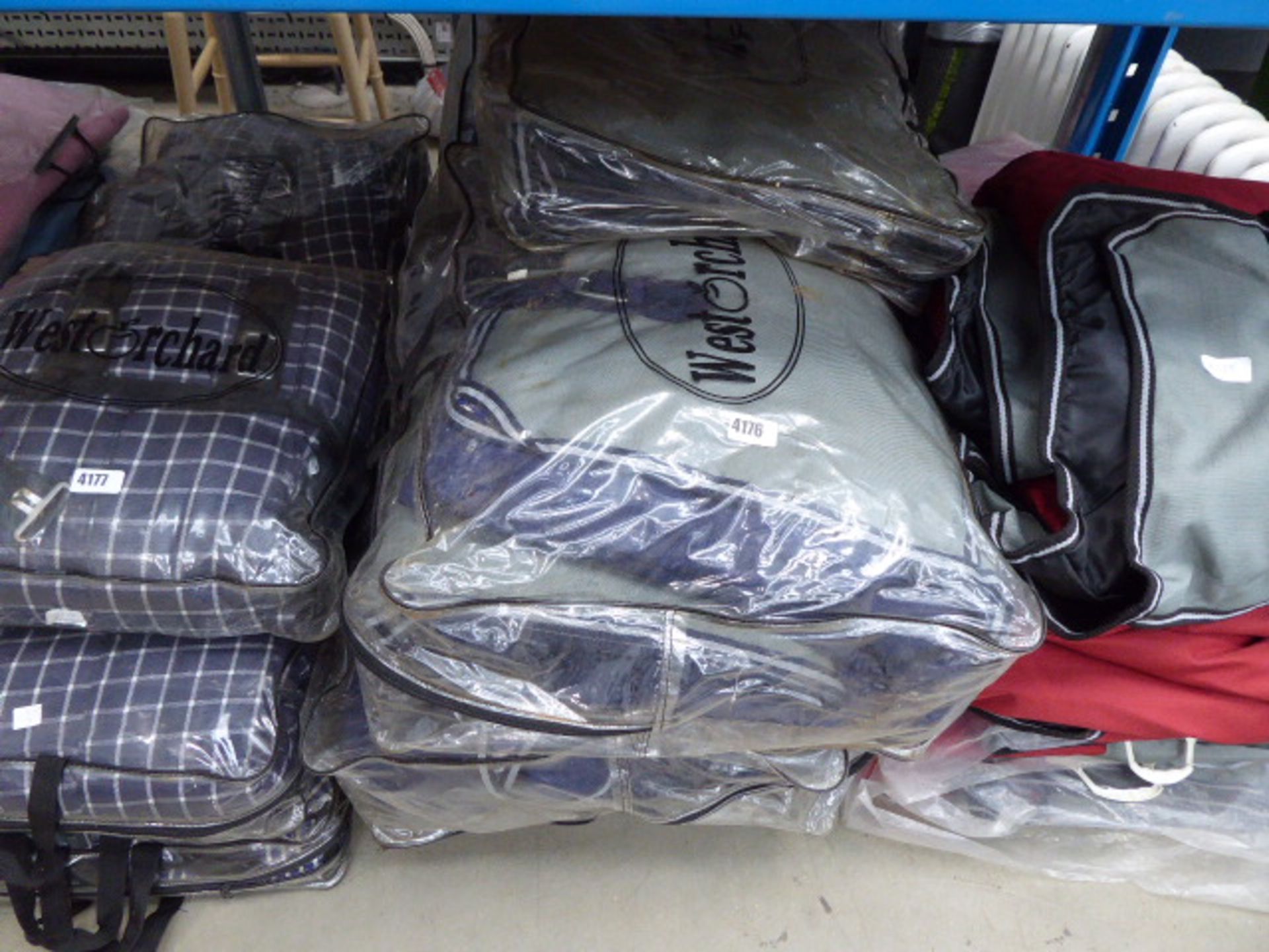 7 large grey and blue bagged horse blankets