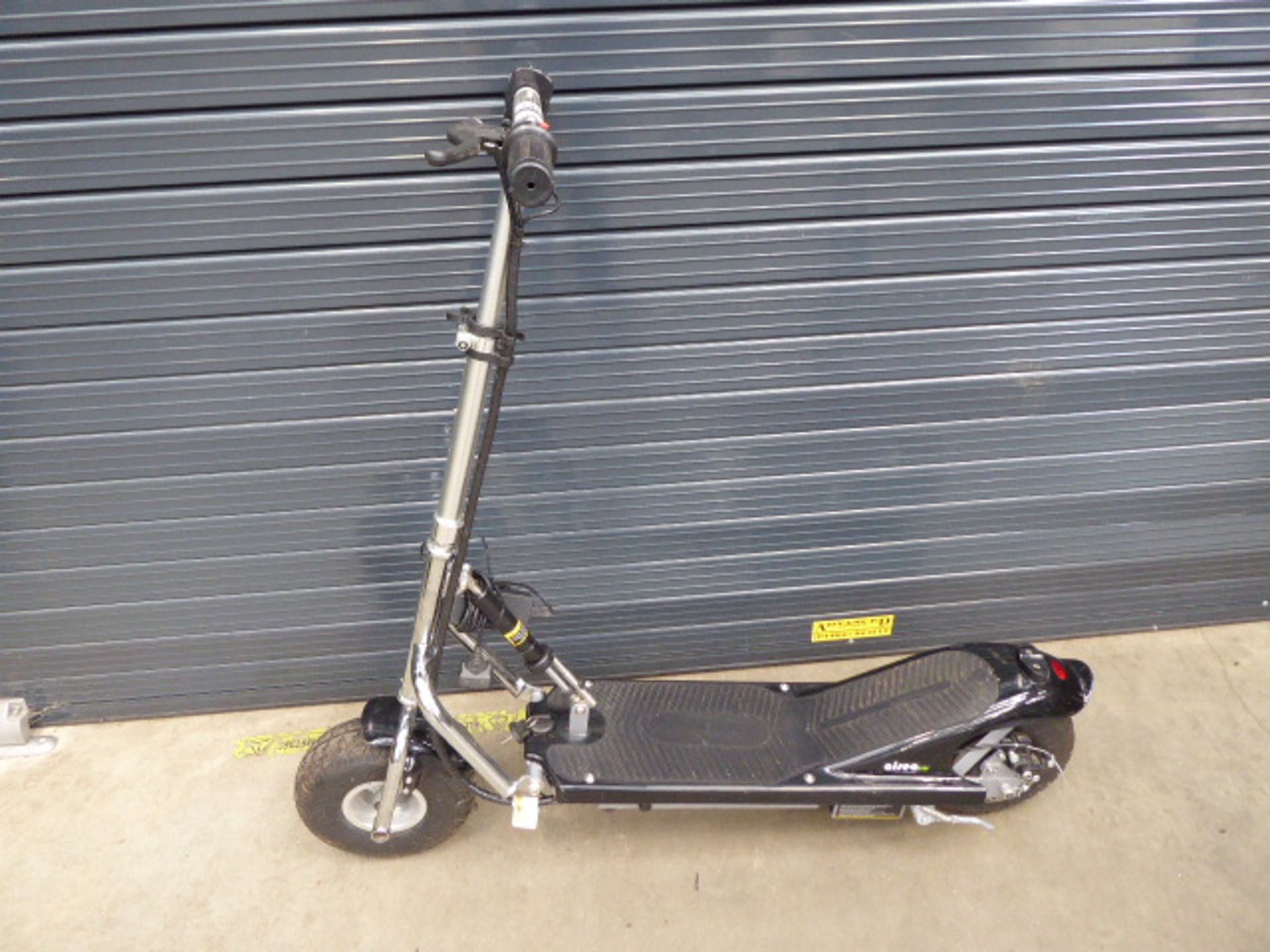 Electric scooter with key and charger