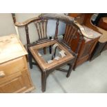 A carved oak corner chair (for restoration)