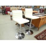 Pair of cream leather effect swivel bar stools