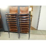 Stack of 10 bent wood chairs on metal frames