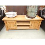 Oak entertainment unit with cupboards to the side