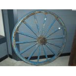 Blue painted cart wheel