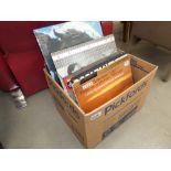 A box containing vinyl records