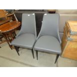 Pair of grey upholstered dining chairs