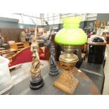 Two spelter figures, plus a brass oil lamp with green glass shade