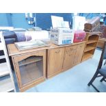 A faux pine sideboard, matching open fronted bookcase and a hi-fi cabinet