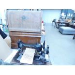 2 cased sewing machines