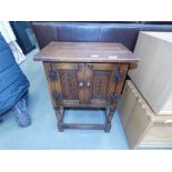 5347 - An oak double door cupboard on raised supports