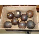 Box containing 8 wooden boules