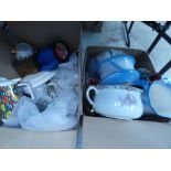 2 boxes containing glassware, cutlery, modern cuckoo clock and a 2 tone flagon and an oil lamp