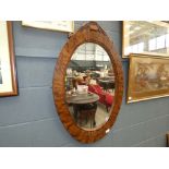 Oval walnut Victorian mirror