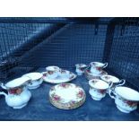 Cage containing Royal Albert old country rose patterned crockery