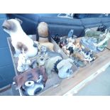 2 boxes containing resin and pottery dog figures