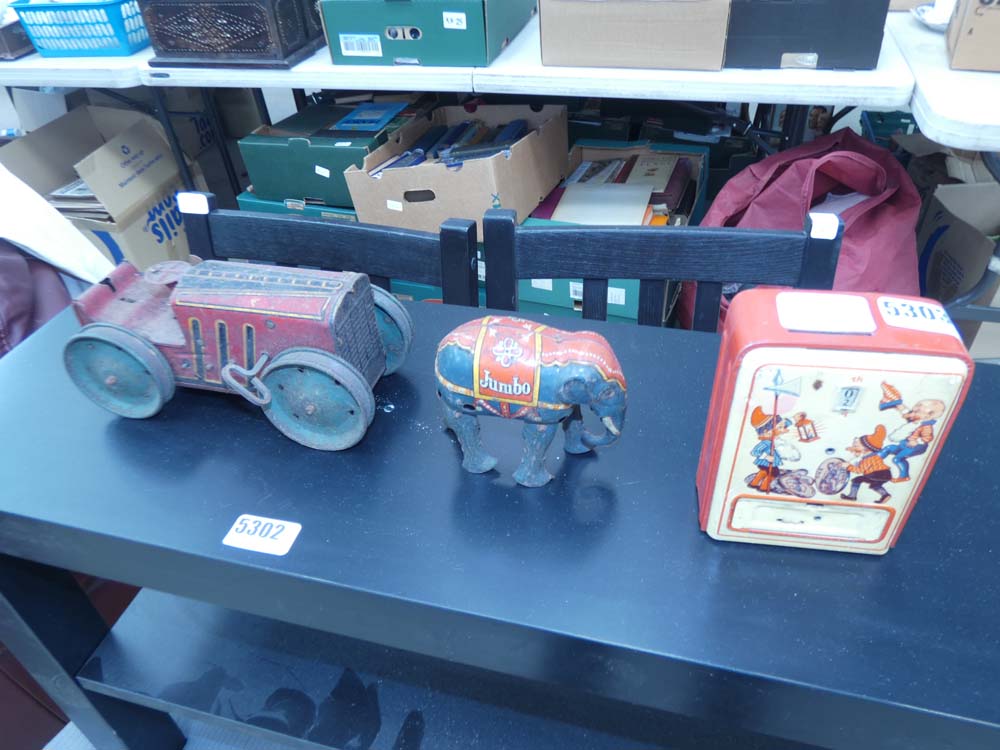 Tin plate money box, a wind up elephant and car