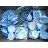 Box containing jelly molds, blue and white china, plus cups and saucers with gold rim