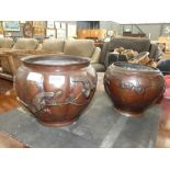 Pair of metallic pots with bear decoration