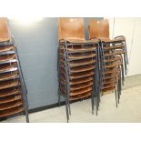 Stack of 10 bent wood chairs on metal frames