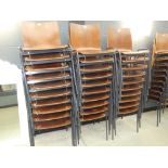 Stack of 10 bent wood chairs on metal frames