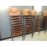Stack of 10 bent wood chairs on metal frames