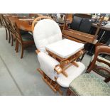 5129 - A beech glider chair with footstool and seude cushions