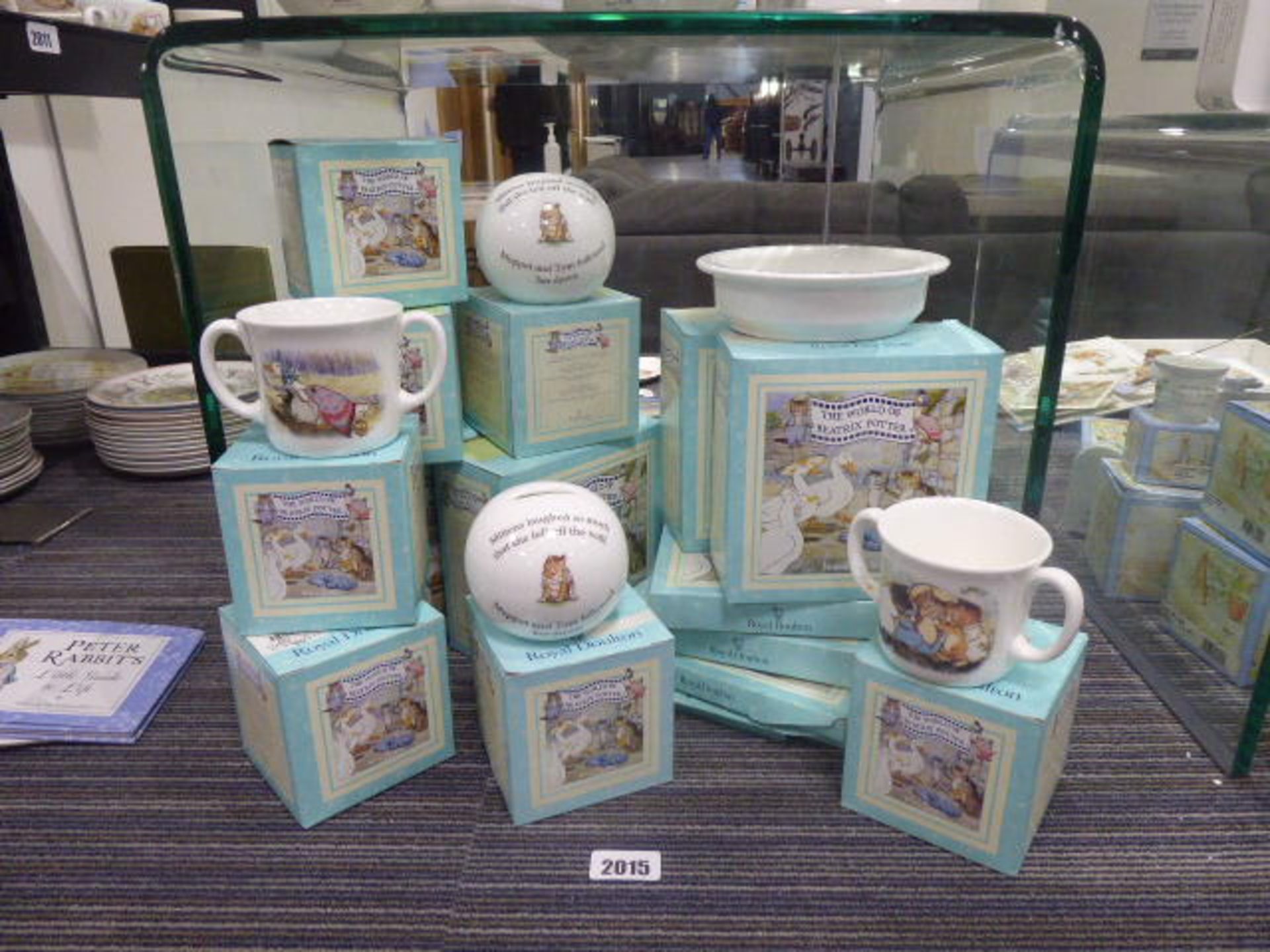 15 boxed Royal Doulton Beatrix Potter themed collectable items in porcelain to include cups, money