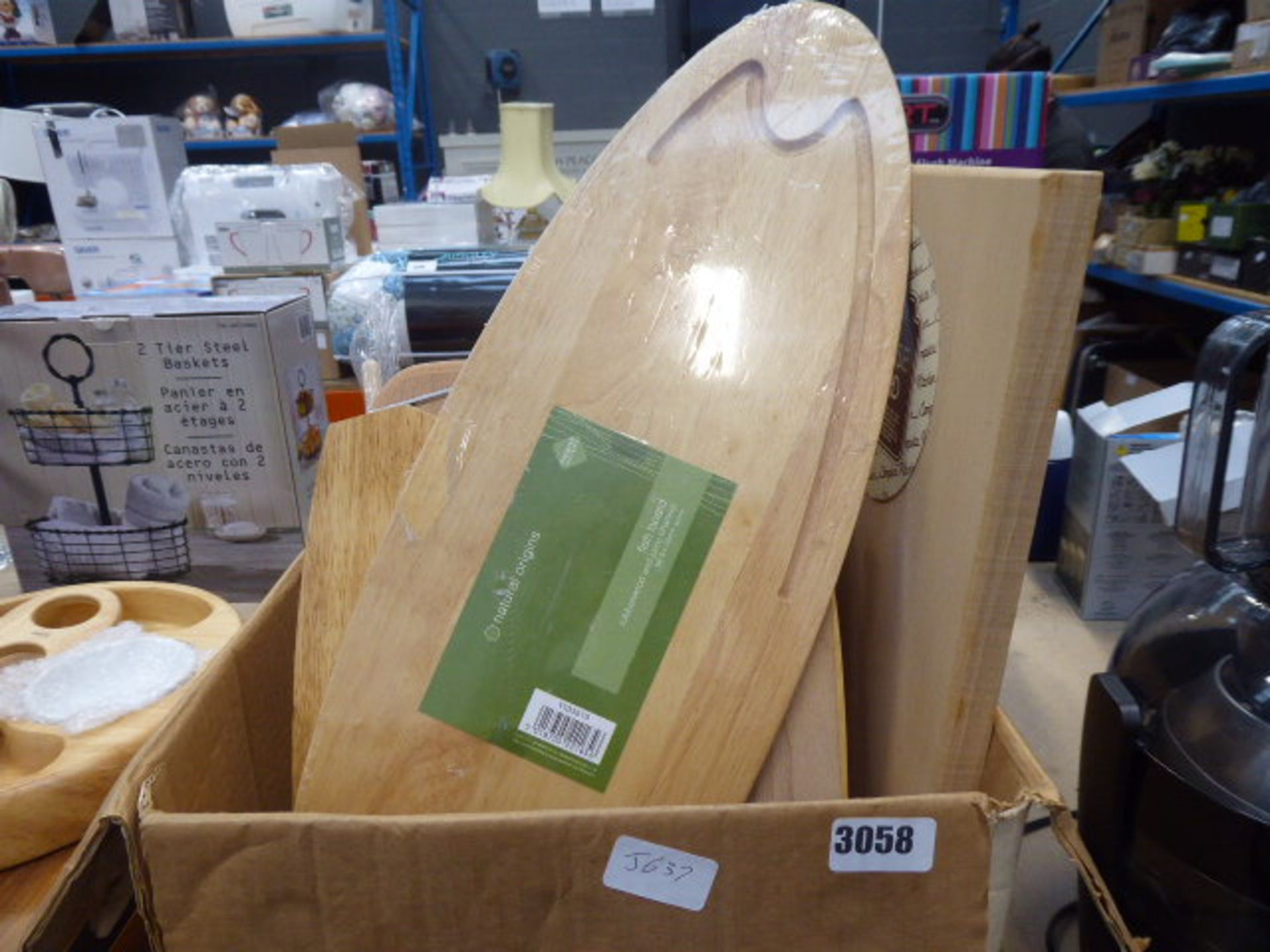 Box containing a selection of various chopping boards