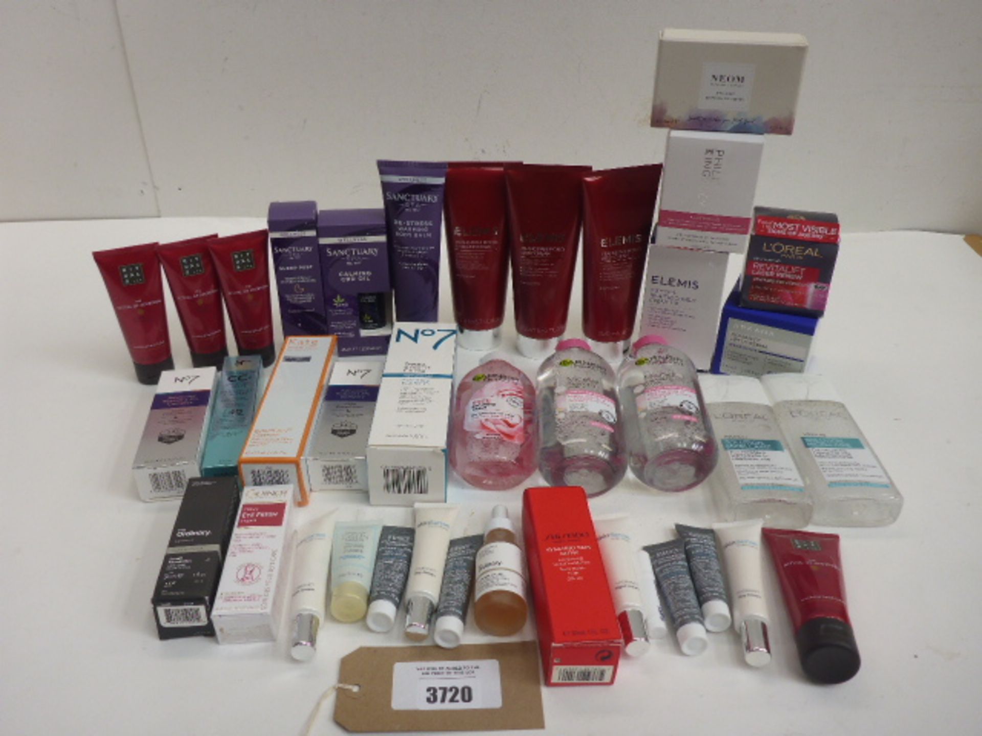 Bag of branded beauty products including Elemis, Neom, L'Oreal, it, No. 7 and others