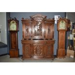 Heavily carved dark wood 6 door sideboard with cupboard over with carved panels of knights, dragons,